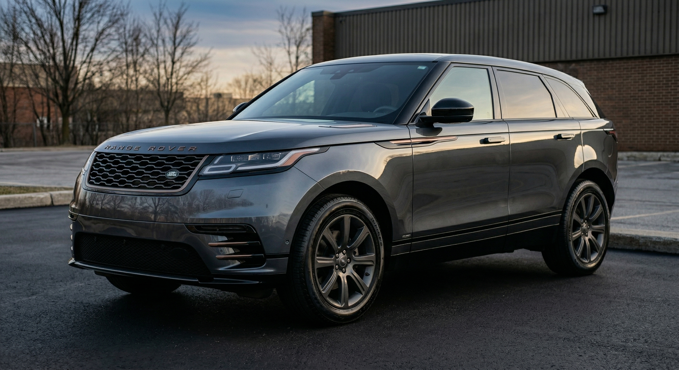 After: perfectly detailed Range Rover Velar at golden hour, deep gloss paint