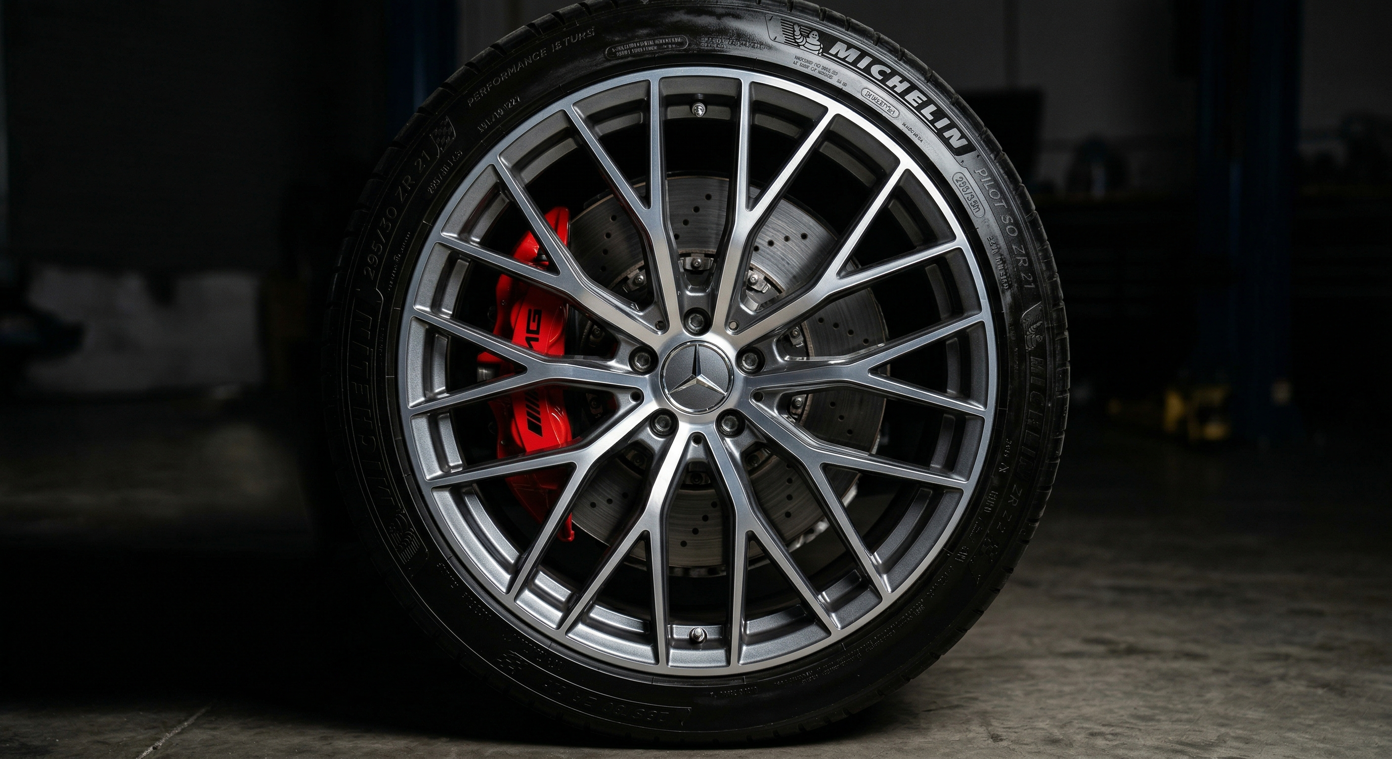 Immaculate luxury alloy wheel and red caliper after professional detailing